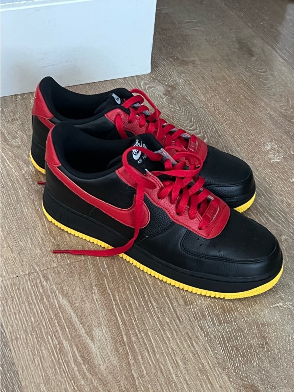 Men's Low-Top Black Sneakers with Red Accents and Yellow Sole
